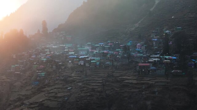 Scenic Aerial View of Malana Village in Himachal Pradesh Surrounded by Majestic Himalayan Mountains, Traditional Wooden Houses, Green Valley, Dense Forest, Remote Mountain Settlement and Beautiful Nat