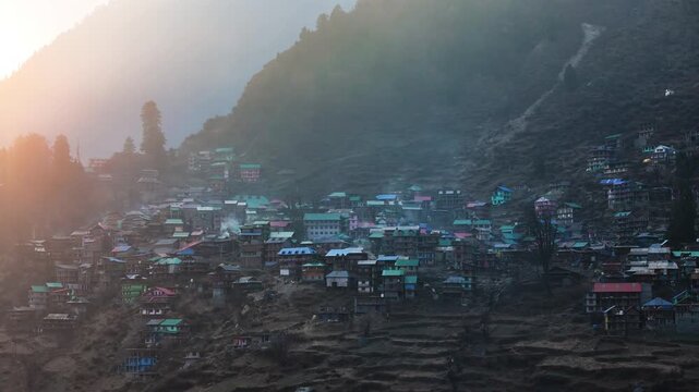 Scenic Aerial View of Malana Village in Himachal Pradesh Surrounded by Majestic Himalayan Mountains, Traditional Wooden Houses, Green Valley, Dense Forest, Remote Mountain Settlement and Beautiful Nat