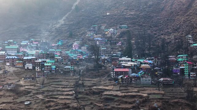 Scenic Aerial View of Malana Village in Himachal Pradesh Surrounded by Majestic Himalayan Mountains, Traditional Wooden Houses, Green Valley, Dense Forest, Remote Mountain Settlement and Beautiful Nat