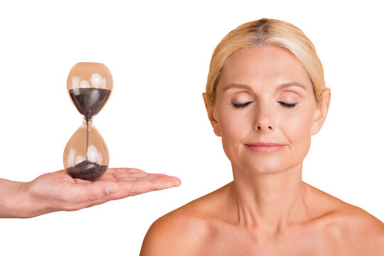 Portrait calm middle aged woman have skincare spa salon procedure time cant change isolated beige color background