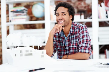 Property development, portrait or black man in office with model, pride or urban planner in building project. Happy, layout or person with confidence, architect or about us as infrastructure engineer © peopleimages.com