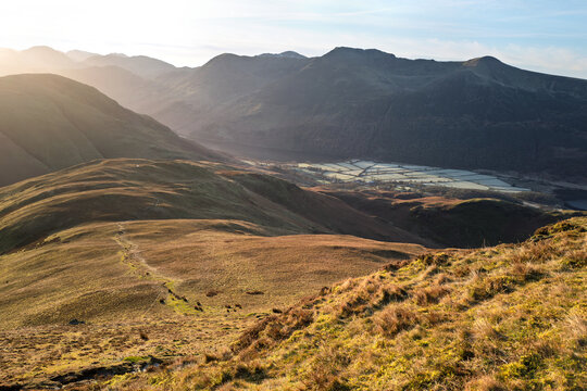 Views down towards Whiteless Breast and Rannerdale with the summits of High Crag, High Stile and Red Pike in the distance in the Lake District, Cumbria, England UK.
