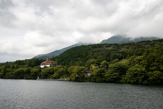 Serene view of Lake Ashi with misty mountains in Hakone, Japan