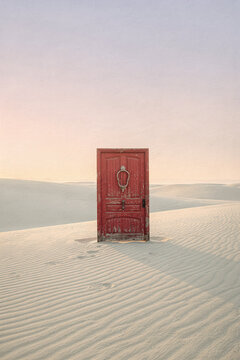 Surreal Red Door Standing Alone in Vast Desert Sand Dunes