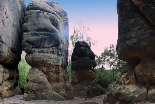 Hiking through the Schramm gate one of the rock formations in the Elbe Sandstone Mountains called Schrammsteine (Bad Schandau, Saxon Switzerland, Germany)