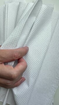 White paper towels moving in the wind for hygiene and household concept