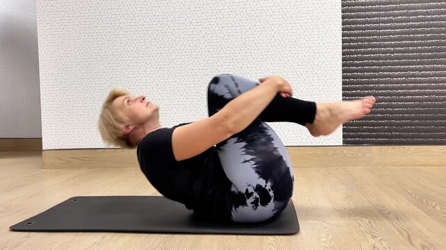 A person demonstrates four different movements for core strength. Each exercise targets different parts of the core.