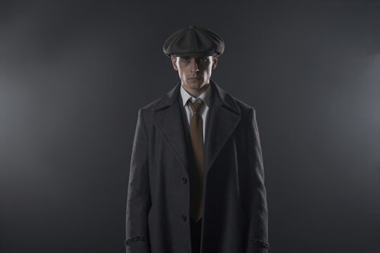 1920s Gangster in Vintage Overcoat and Flat Cap, Generative AI