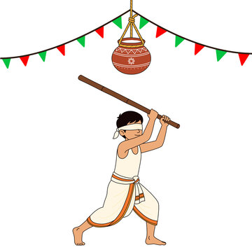 Blindfolded boy playing uriyadi hitting clay pot with stick, kerala onam festival and krishna janmashtami celebration 