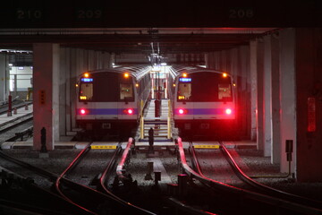Fototapeta premium Taipei, Taiwan - July 3rd, 2026 - Two modern subway trains parked inside the maintenance depot.