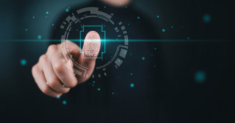 Fototapeta premium Person touching digital biometric fingerprint scanner for secure identity verification system and cyber protection.