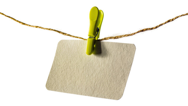 Yellow clothespin holding blank beige card on twine string