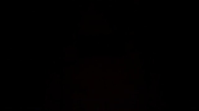 Abstract video of a sharp rainbow prism arc sweeping quickly across a dark background, creating vivid chromatic flashes, clean light bursts transitions for cinematic overlays and motion graphics.