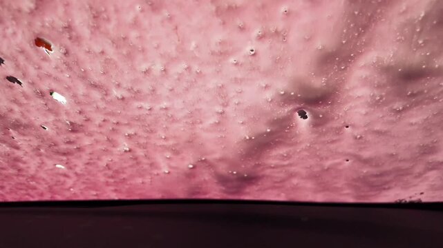 Automatic car wash, view from inside the car interior. High quality 4k footage