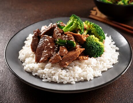 beef and broccoli stir fry served over rice