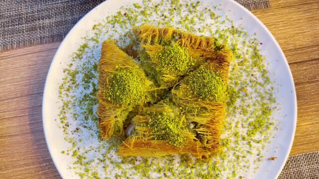 Traditional Turkish Dessert Platter with Kadayıf and Dondurma Ice Cream on a Rustic Table