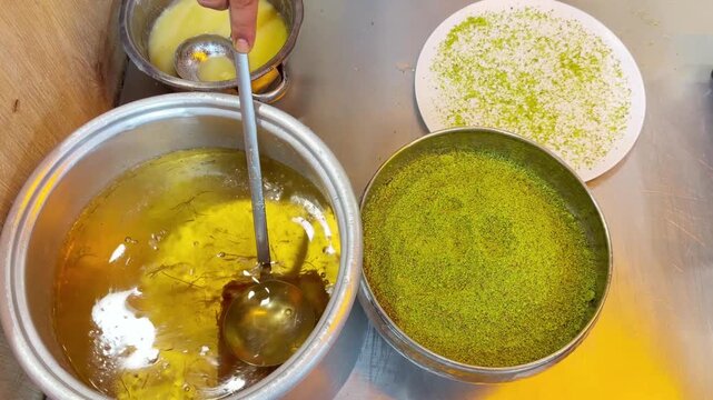 Cooking Process &ndash; Frying Traditional Turkish Kadayıf Pastry in a Large Skillet on a Stove Top.Frying Kadayıf on the Stove &ndash; Turkish Dessert Preparation