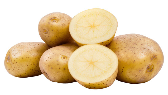 Whole and halved raw potatoes with yellow flesh and brown skin