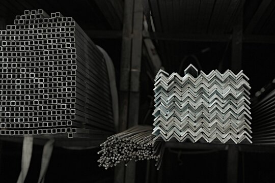 Industrial metal warehouse. Organized steel sections on cantilever racks. Industrial metal storage racks.
