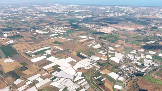 Aerial View of the Earth's Landscape Seen Through an Airplane Window on a Clear Day with No Clouds