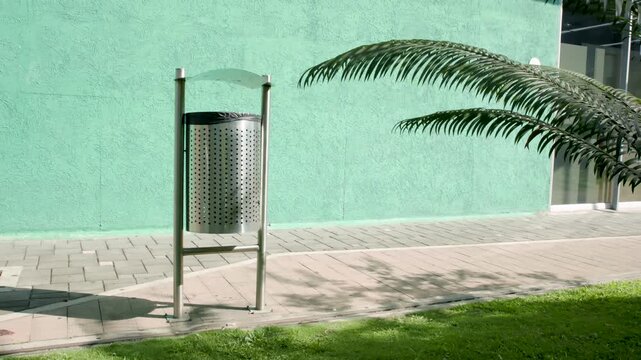 Public Trash Bin in an Urban Green Space Promoting Proper Waste Disposal and Clean Public Environments, Video Recorded in 4K at 60fps 