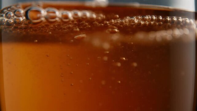 Ultra realistic cinematic footage of abstract beverage motion and bubbles, macro, no people, 4K UHD