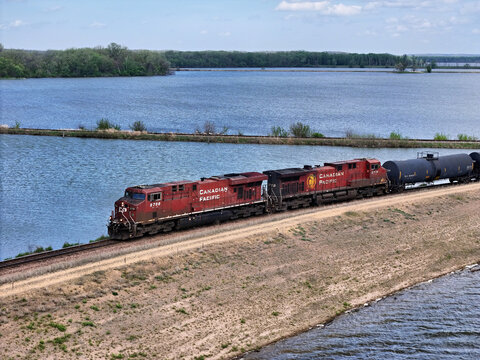 Sabula, Iowa, April 23, 2026: Canadian Pacific Railroad locomotive pulling a freight train along the back waters of the Mississippi river