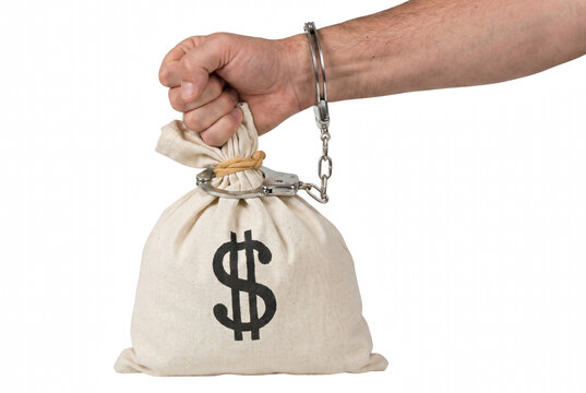 Male Hand Handcuffed to a Canvas Bag with Dollar Sign Representing Financial Crime