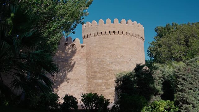 Daytime View of Medieval Stone Castle Tower Surrounded by Greenery