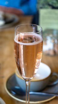 Ros&eacute; sparkling wine or champagne in a crystal flute. Prosecco in a crystal glass