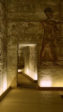 Ancient Egyptian wall paintings with detailed hieroglyphs and ritual scenes inside the Abu Simbel Temple, revealing sacred art, mythology, and preserved history. Egypt.