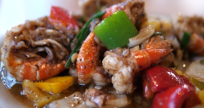 Close up of stir fried prawns with black pepper sauce