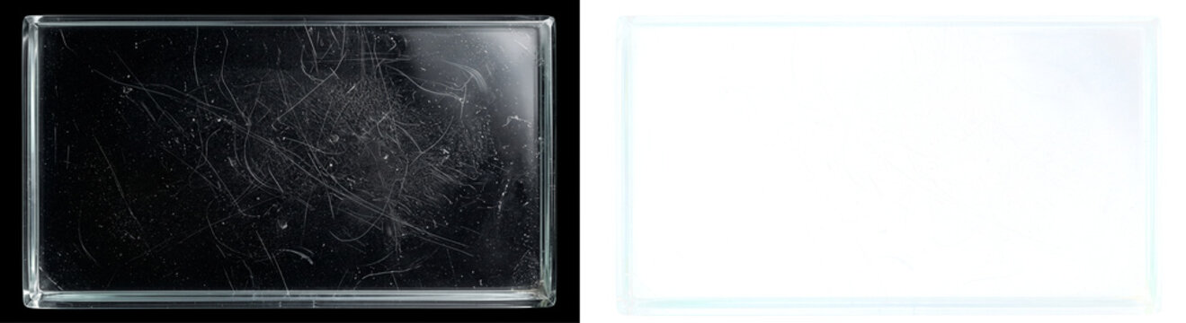 Clear glass pane with numerous scratches and scuffs against deep black background, highlighting damage and texture, ideal for overlay or grunge effects
