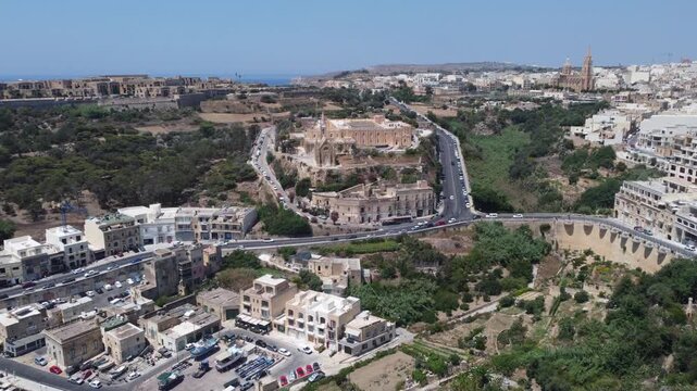 Mgarr, Gozo, Malta 29.06.2026 - Aerial view of Church of the Madonna of Lourdes in Mgarr, close to the fery terminal . High quality 4k footage