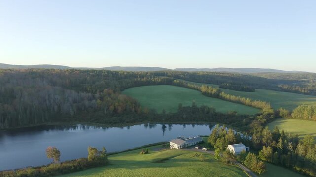 Rural Farmhouse Beside a Peaceful Lake in the Canadian Countryside Aerial Drone View