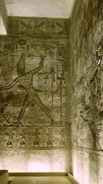Ancient Egyptian chamber with statues and decorated ceiling inside the Abu Simbel Temple, showcasing sacred architecture, carvings, and timeless spiritual symbolism. Egypt.