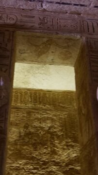 Ancient Egyptian chamber with statues and decorated ceiling inside the Abu Simbel Temple, showcasing sacred architecture, carvings, and timeless spiritual symbolism. Egypt.