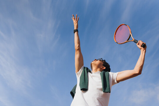 Young Man Playing Tennis