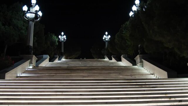 Nighttime View of Illuminated Outdoor Staircase with Lamp Posts