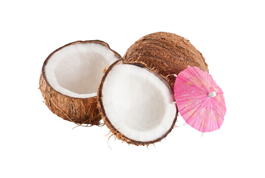 Tropical Coconut Halves with a Pink Cocktail Umbrella