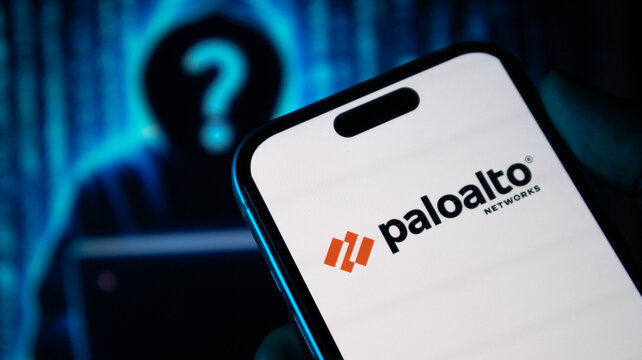 Smartphone showing palo alto networks logo against background of hooded hacker silhouettes.