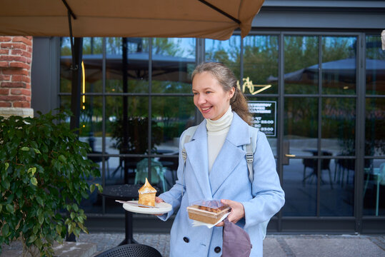 Woman carring pastries after purchase