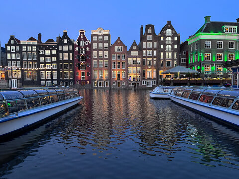 Amsterdam houses along a canal at dusk