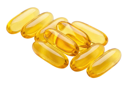 Golden fish oil softgel capsules with omega 3 on a dark surface