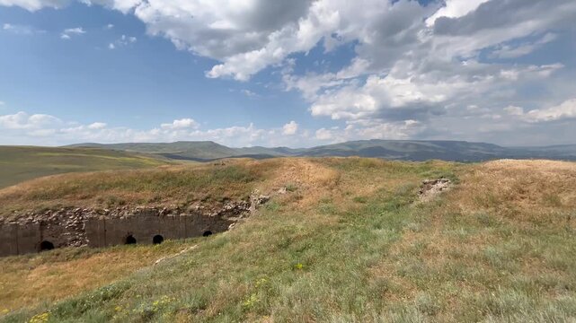 Establishing shot of the historical K&uuml;&ccedil;&uuml;k H&ouml;y&uuml;k Tabya (redoubt) fortifications, showcasing traditional stone military architecture in Erzurum, Turkey