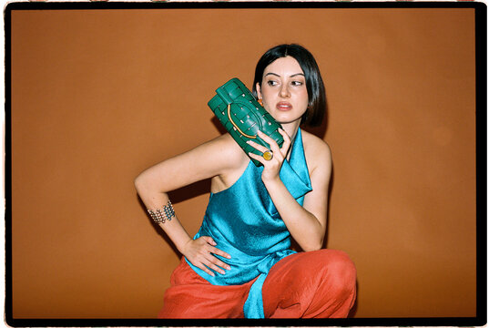 Woman with green purse 