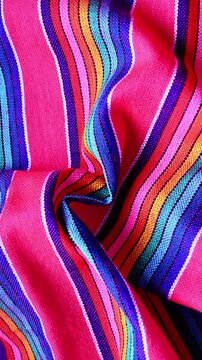 Mexican folk art textile with colorful striped pattern