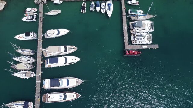 Aerial view off boats in emerald waters of Mediterannean sea, Gozo, Mgar, Malta. High quality 4k footage