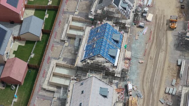 Residential Construction Site Progress With Solar Panels on Homes