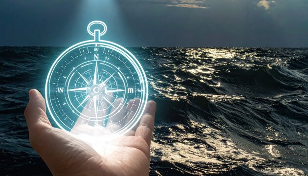 Hand holding glowing compass over stormy ocean waves at dusk.